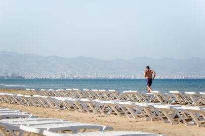Man running along the empty beach - 9251.pics